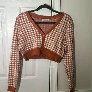 I’m selling this super fun checkered sweater from Urban outfitters in size large